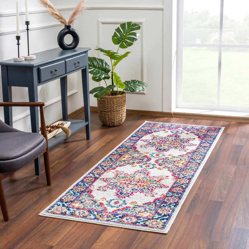 Entryway with Istanbul Medallion Orange Area Rug runner, blue console table, gray chair, and wood floors. Roomscene-Runner