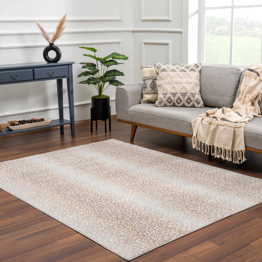 Living room scene with a gray sofa and Pointblank Tan Leopard Print Rug on a wood floor. Roomscene-Rectangle
