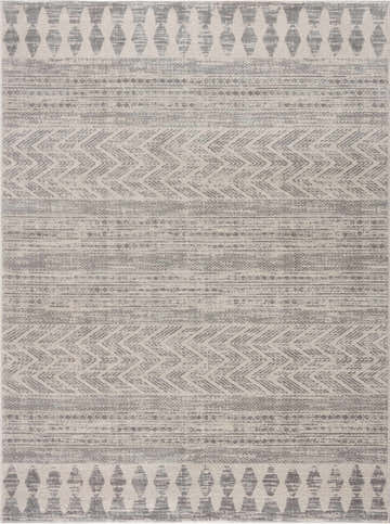 Close-up of the Chinnor Area Rug featuring a Bohemian gray and off-white geometric pattern and machine-woven texture. Design-Rectangle