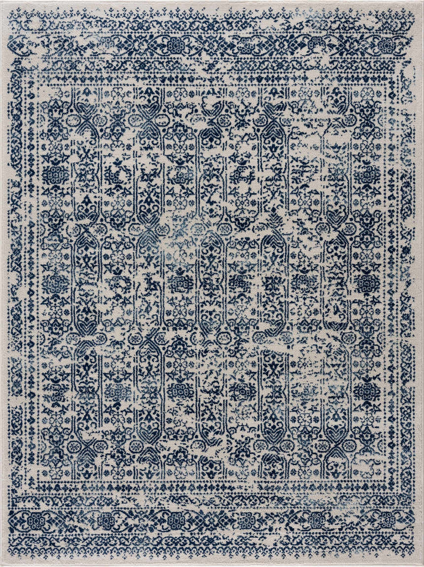 Close-up of the Michie Blue Area Rug featuring a traditional, distressed dark blue and white pattern. Design-Rectangle