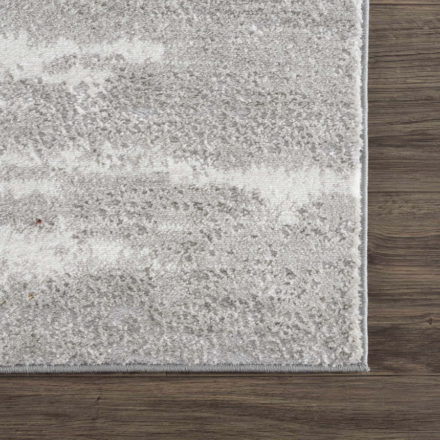 Close-up of the Live Marble Gray Area Rug showing its textured charcoal, light gray, and off-white pattern. Swatch