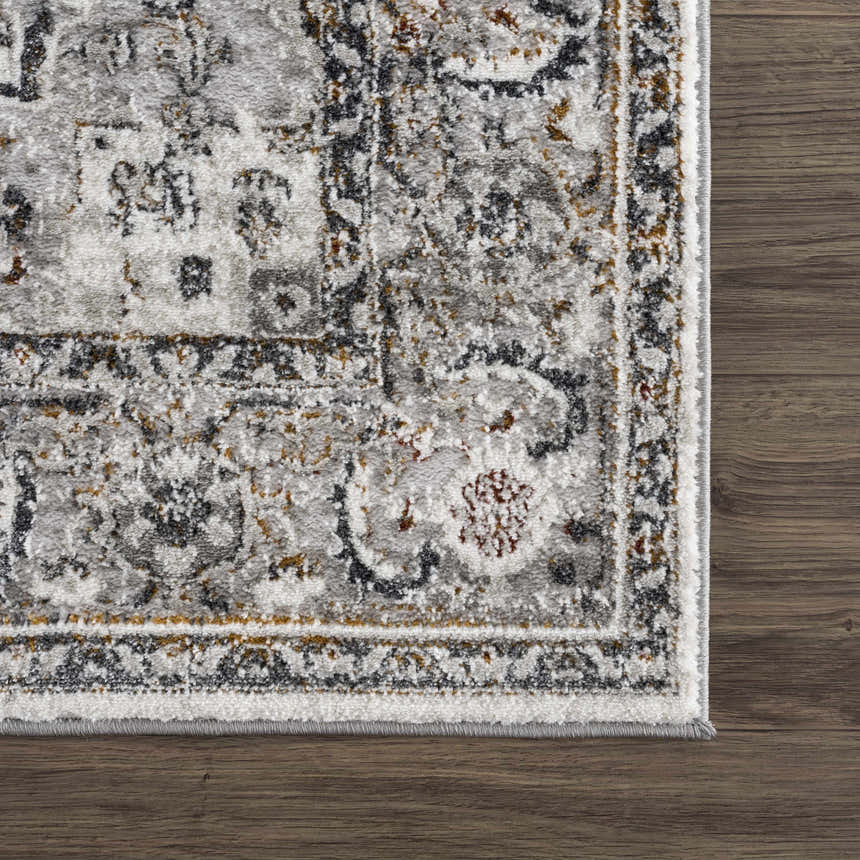 Close-up of the Liverpool Dark Gray Area Rug showing its traditional charcoal, gray, rust, and off-white pattern. Swatch
