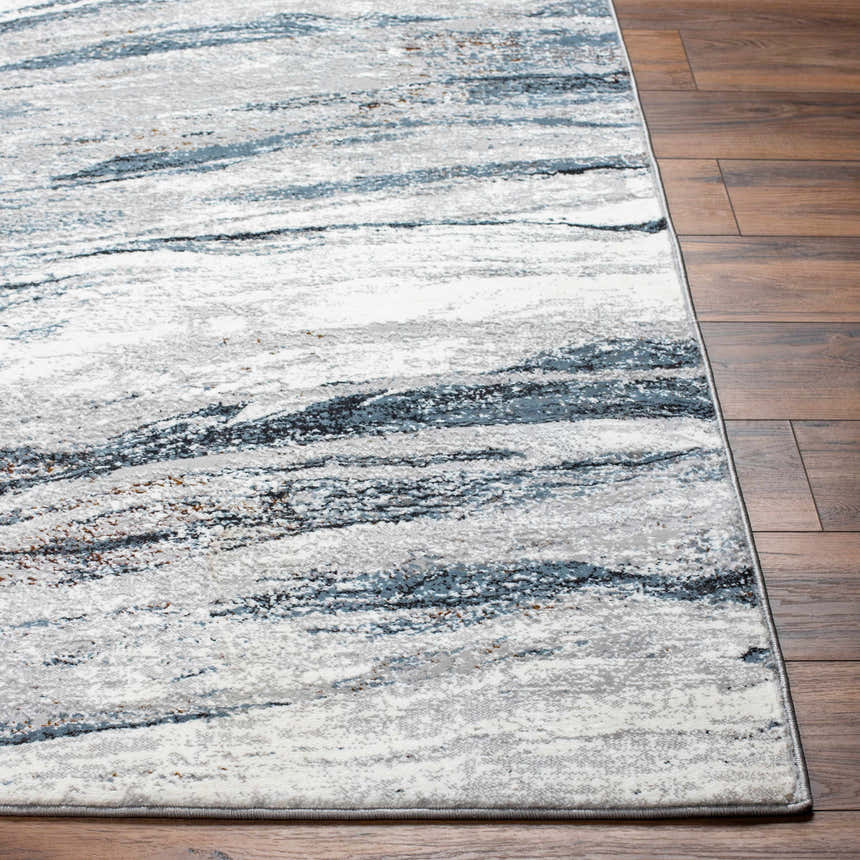 Close-up of Glain Gray & Blue Marble Area Rug showing its abstract, Southwestern design and soft, textured pile. Front