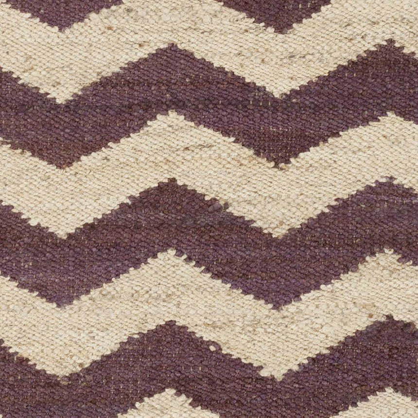 Close-up of Saginaw Jute Carpet. Beige and dark purple chevron pattern. Hand-woven texture. Farmhouse style rug. Swatch