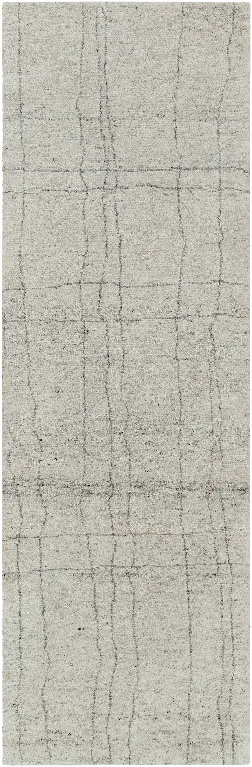 Close-up of the Saldanha Premium Rug, a hand-knotted rug in charcoal, gray, and light gray with a contemporary design. Design-Runner-268
