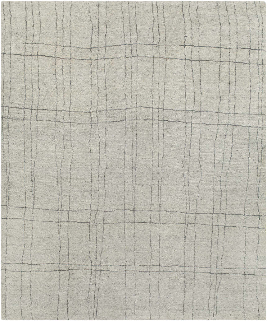 Close-up of the Saldanha Premium Rug, a hand-knotted wool and viscose rug in charcoal, gray, and light gray with a contemporary grid pattern. Design-Rectangle-810