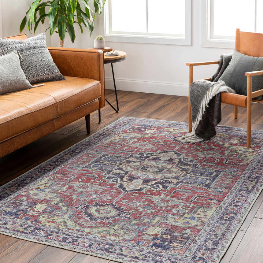 Living room scene with a Reza Red Washable Rug, leather sofa, wood chair, and hardwood floors. Farmhouse style. Roomscene-Rectangle