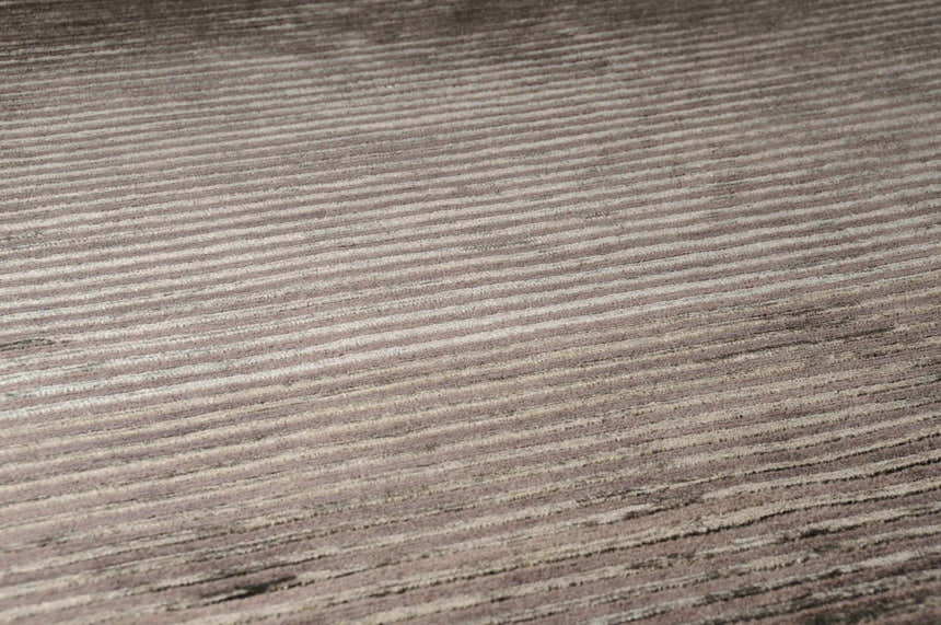 Close-up of the hand-knotted Sanatoga Area Rug. Features a textured, striped design in neutral beige and brown tones. Texture
