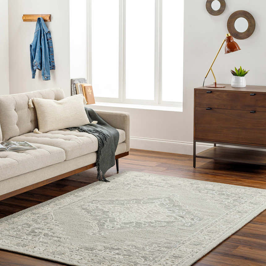 Living room scene with a Nani Gray Wool Blend Area Rug, sofa, and mid-century modern dresser. Roomscene-Rectangle