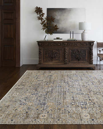 Entryway with a Becki Owens x Livabliss Margaret Damask Brown Washable Area Rug, dark wood floors, and carved console table. Roomscene-Rectangle