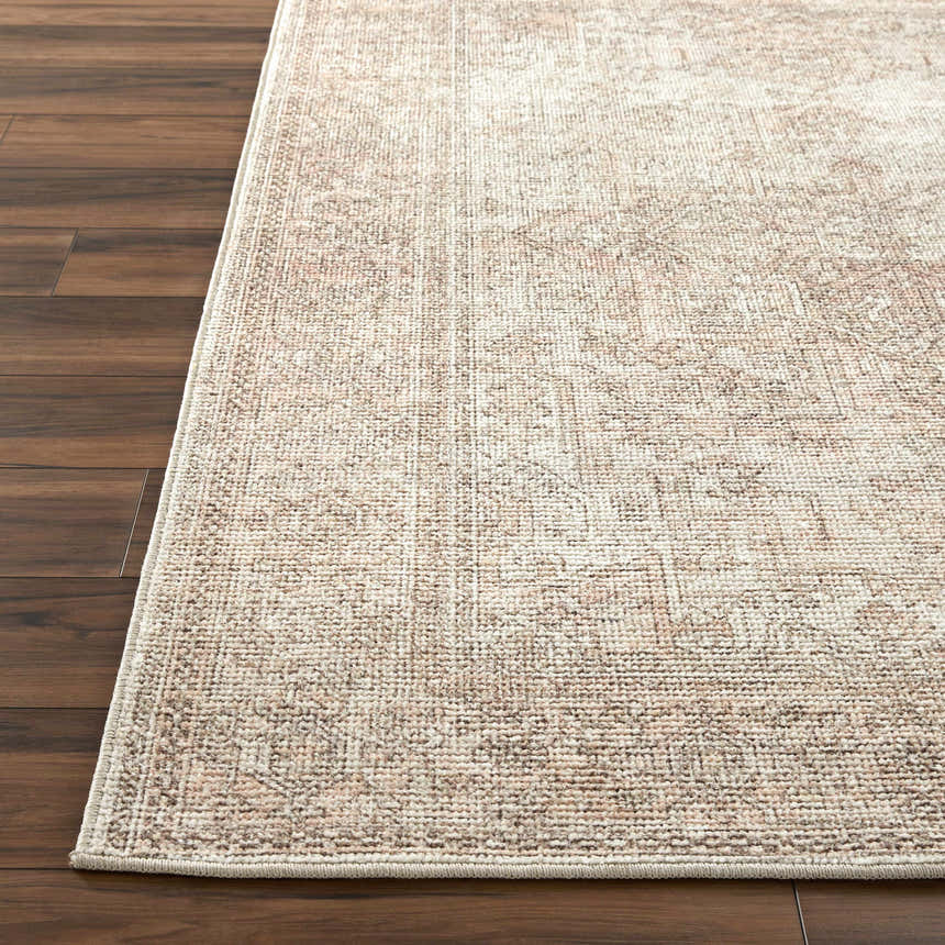 Close-up of the Margot Medallion Dusty Coral rug showing beige, bone, and coral tones with a traditional medallion pattern. Front