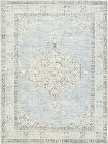 Close-up of Lila Medallion Denim Area Rug. Features a traditional medallion pattern in light blue, gray, and white hues. Design-Rectangle-537