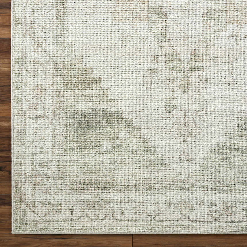 Close-up of the Luca Medallion Olive Area Rug showing its beige, bone, and olive traditional medallion pattern and woven texture. Corner
