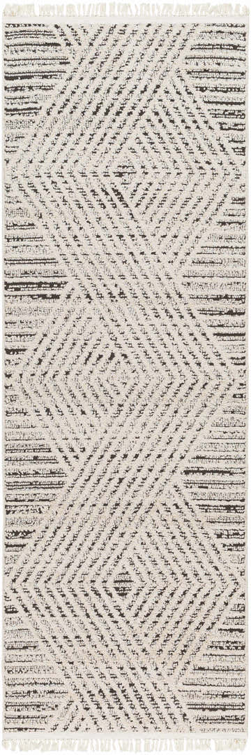 Close-up of the Brita Area Rug, showcasing its bone and dark brown geometric pattern and soft, textured weave. Design-Runner-2710