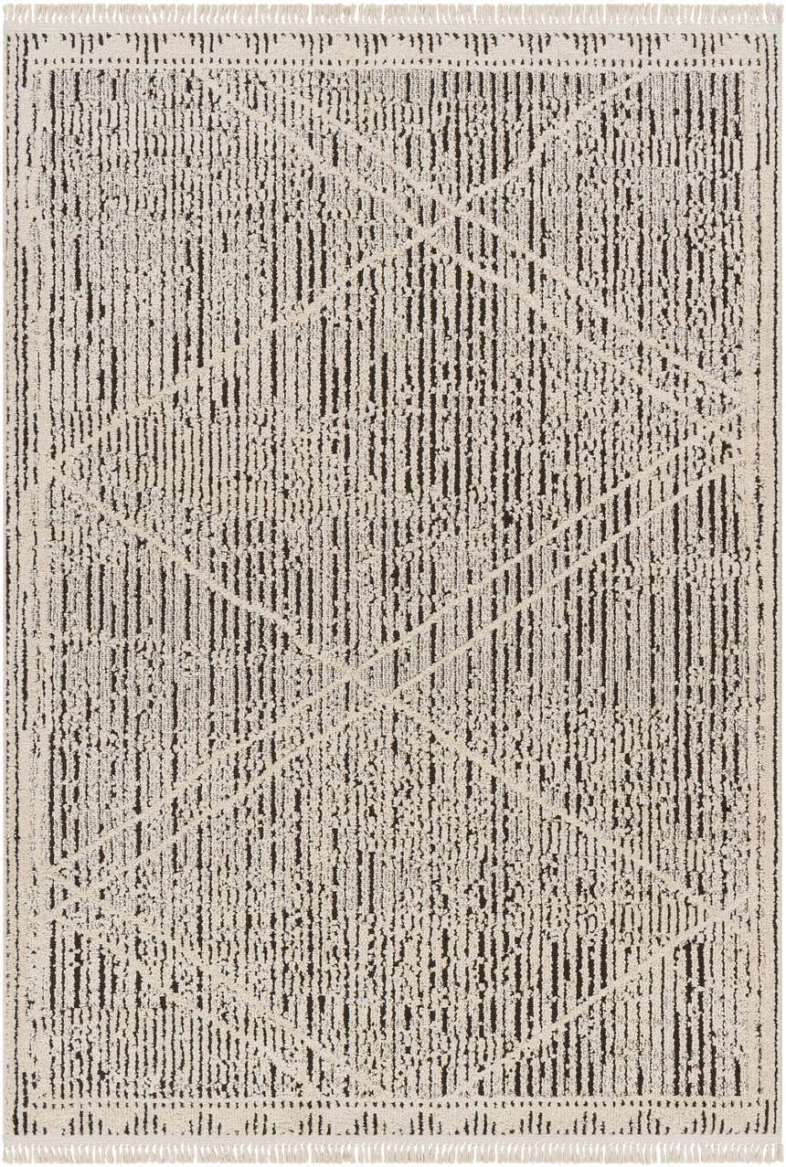 Close-up of the Luuk Area Rug; a machine woven rug in dark brown and ivory with a geometric pattern and fringe. Design-Rectangle-537