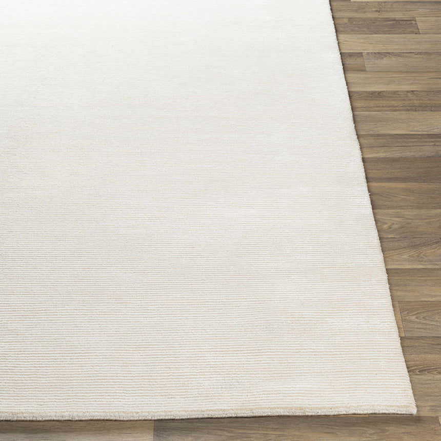 Close-up of the hand-knotted Sabinsville Carpet. Neutral cream color with subtle horizontal texture. Farmhouse style. Front