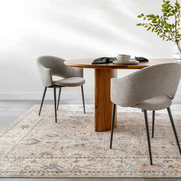 Dining room scene with a round wood table and gray chairs on the Davina Damask Beige rug. Farmhouse style. Roomscene-Rectangle