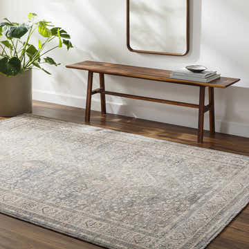 Entryway with Artan Area Rug in gray, wood bench, mirror, and potted plant. Roomscene-Rectangle