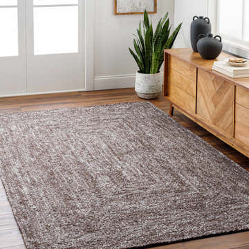 Living room scene with a gray Kenyi Area Rug, wood floors, and a mid-century modern cabinet. Roomscene-Rectangle