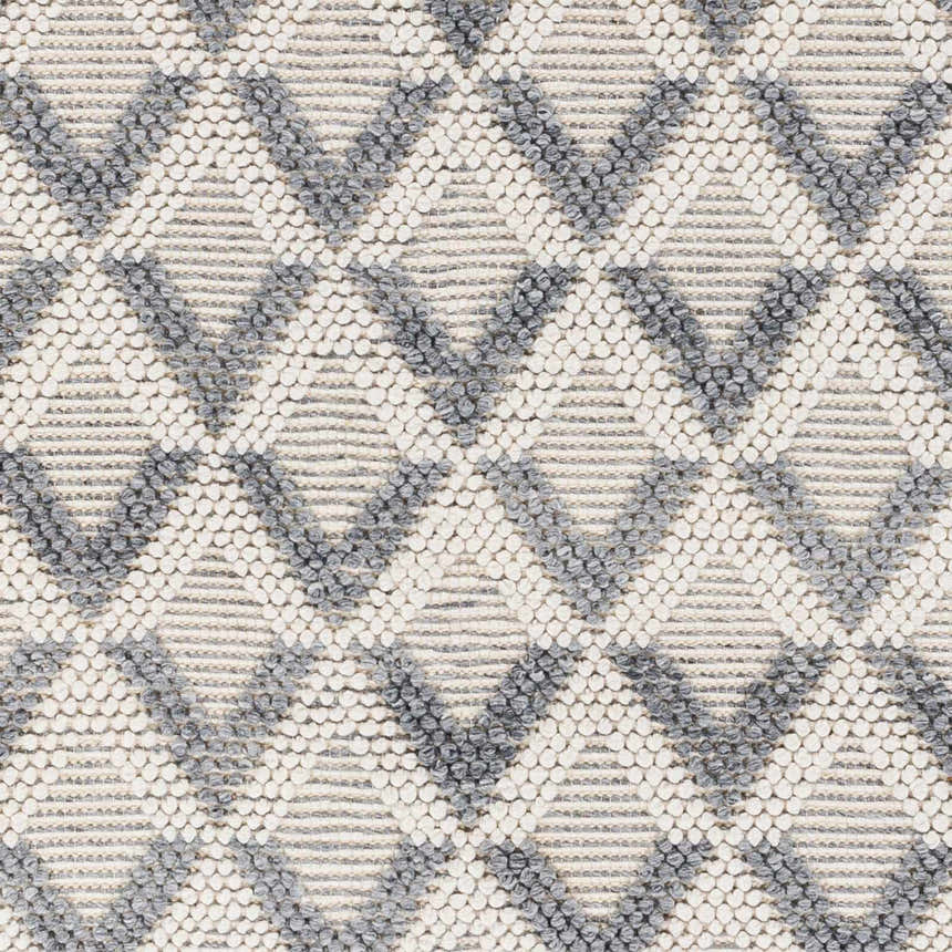 Close-up of the Maik Area Rug showing a gray and off-white geometric diamond pattern and hand-woven texture. Swatch