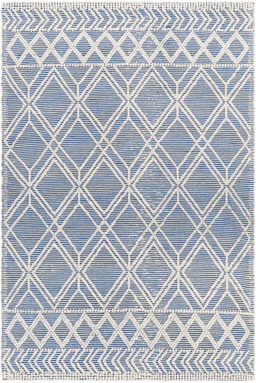 Close-up of the Rika Area Rug, a hand-woven rug with a geometric diamond pattern in arctic stone and denim blue. Design-Rectangle-576