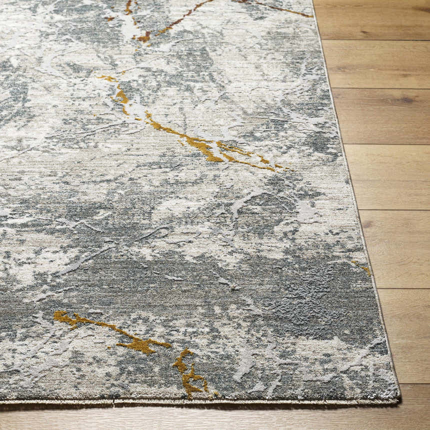 Close-up of the Asena Textured Rug. Gray, light gray, and caramel colors with a contemporary abstract design. Front