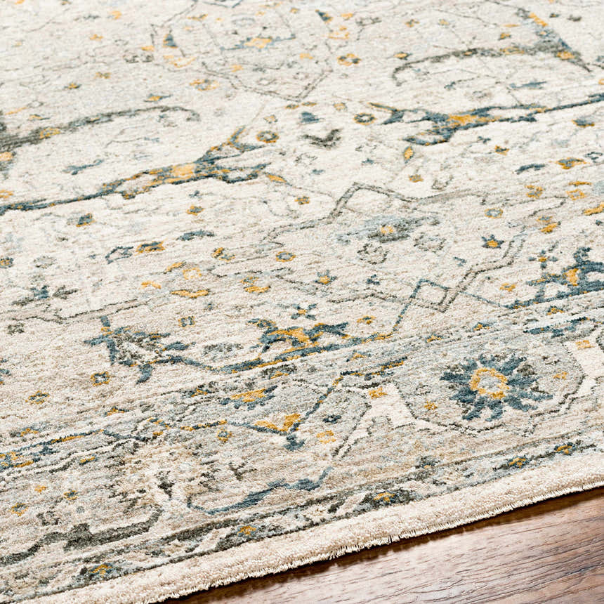 Close-up of the Aviva Off-White Textured Rug. Features a traditional design with dusty sage, gray, and mustard accents. Texture