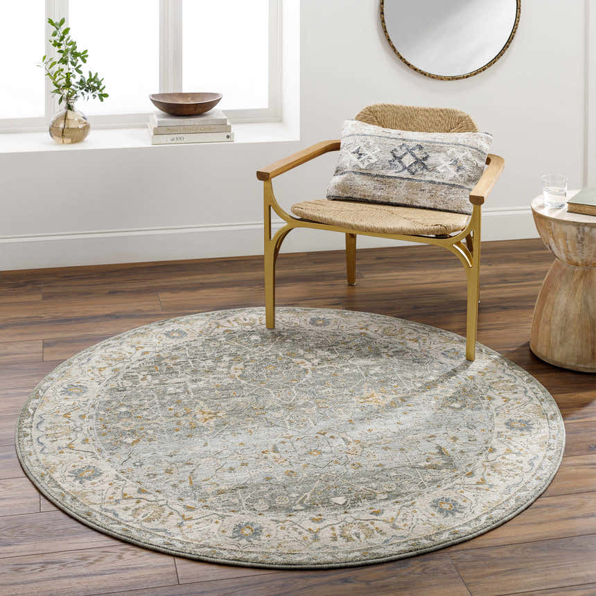 Living room scene with round Aviva Teal Textured Rug, chair, and side table. Roomscene-Round