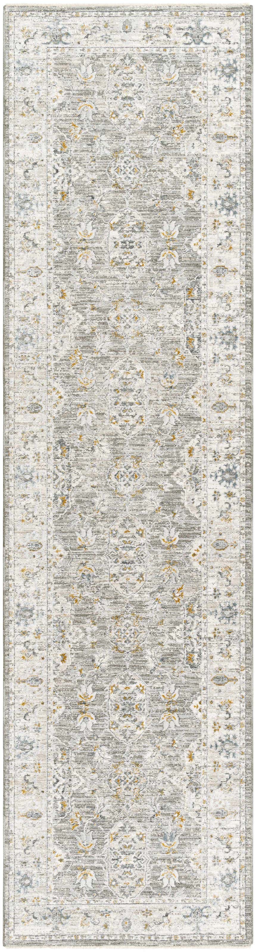 Close-up of the Hafsa Textured Rug. Gray rug with traditional floral pattern and subtle gold and blue accents. Design-Runner