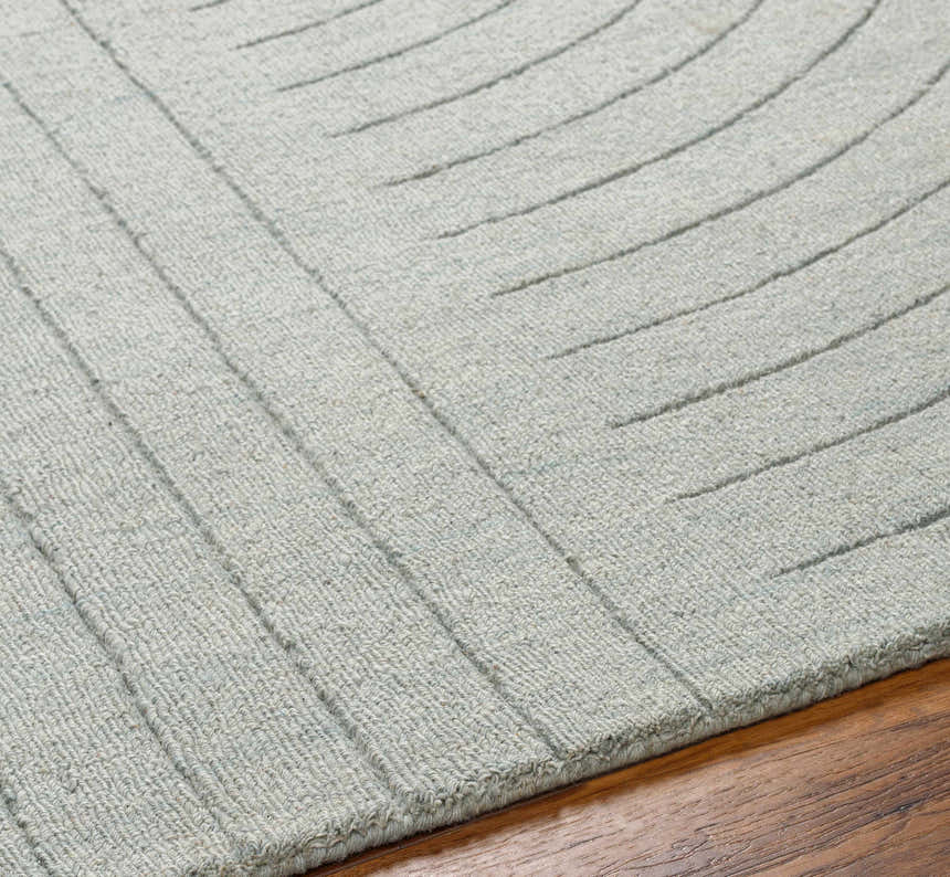 Close up of the hand loomed Ayumi Area Rug. Neutral gray wool with a subtle, contemporary line pattern. Texture