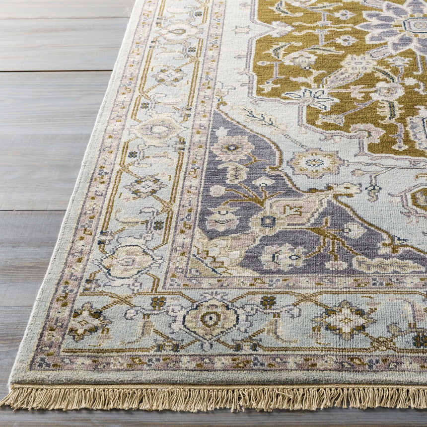 Close-up of the hand-knotted Senath Area Rug. Ivory, olive, mauve, and slate colors with traditional, oriental patterns. Front