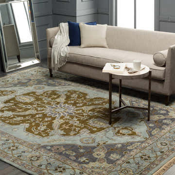 Styled room featuring the Senath Area Rug, a hand-knotted wool rug in ivory, mauve, navy, olive, slate, and tan. Roomscene-Rectangle