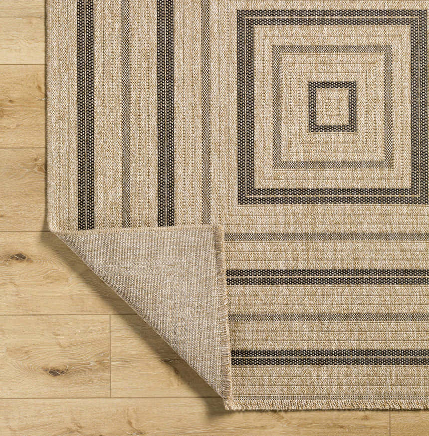 Close-up of Beril Area Rug showing camel and charcoal stripes and concentric squares pattern. Fold