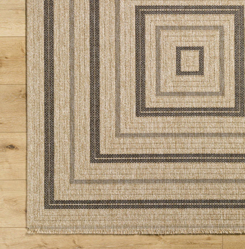 Close up of the Beril Area Rug showing camel and charcoal square pattern and woven texture. Corner
