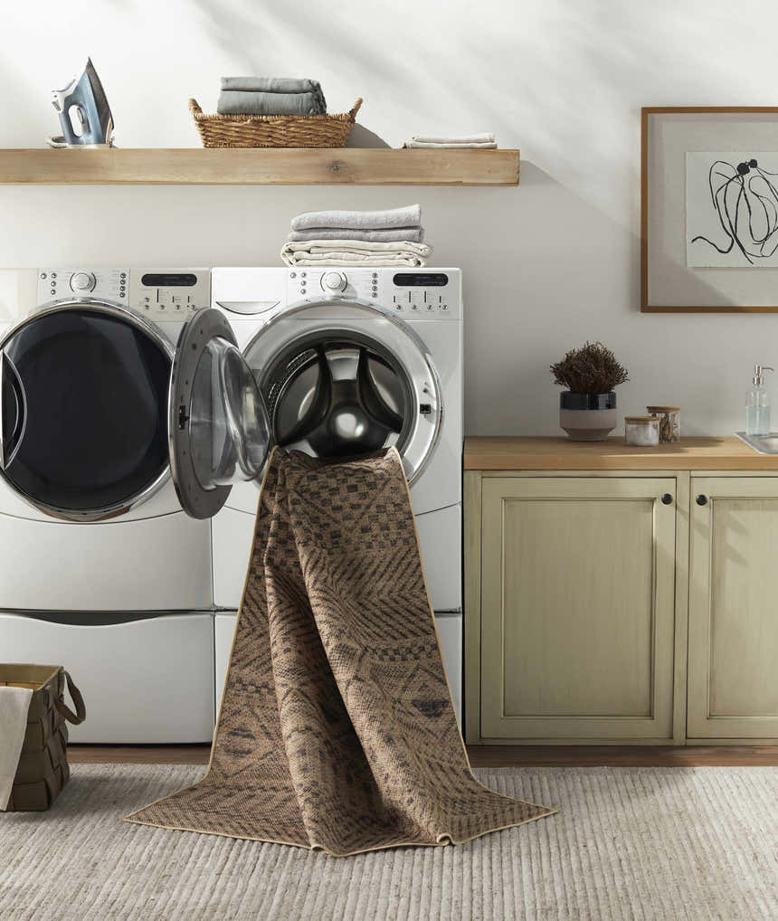 Laundry room scene with Ammar Washable Area Rug being washed. Camel and brown rug in a farmhouse style laundry room. Washing-Machine