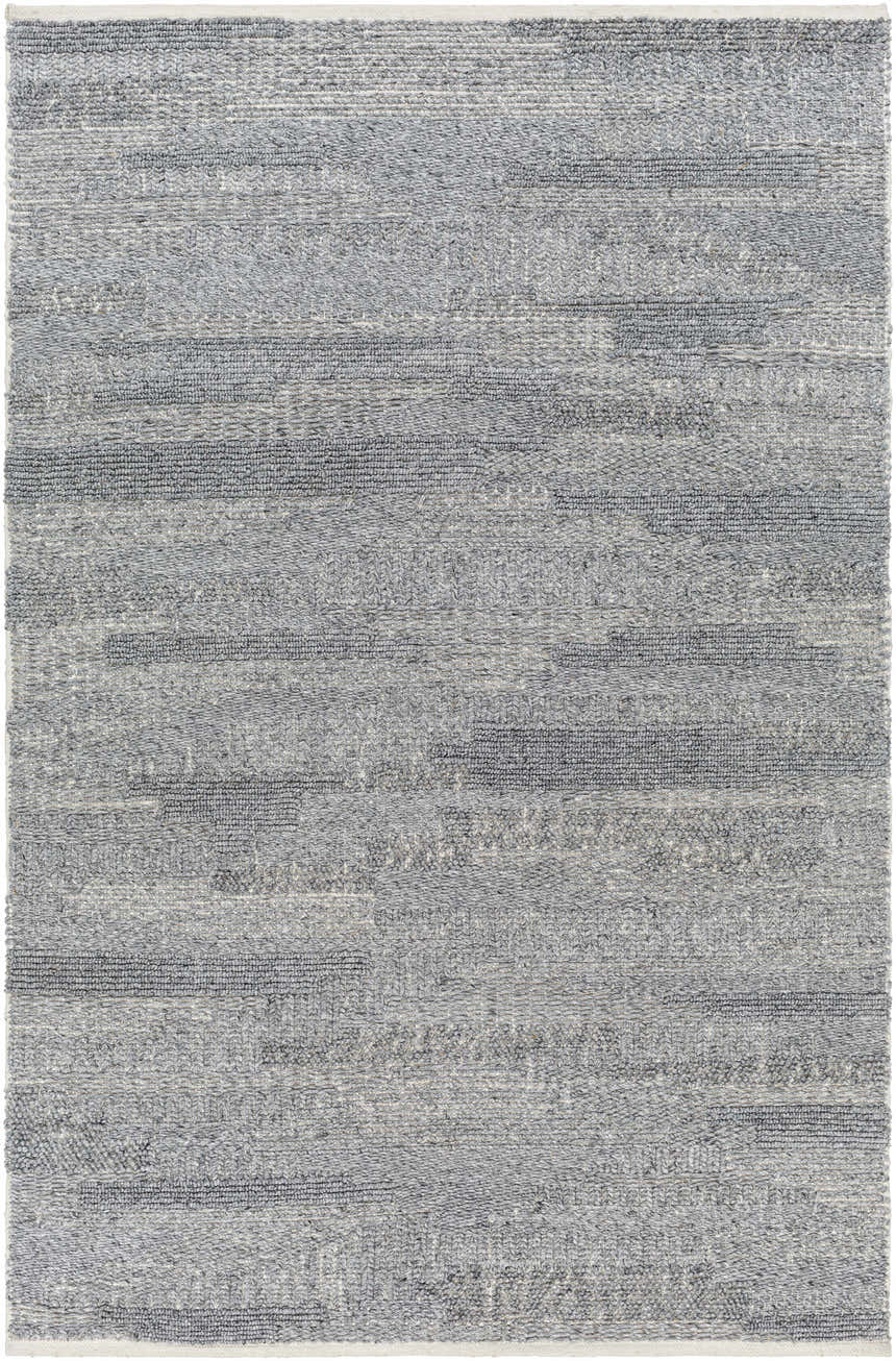 Close-up of the hand woven Chepe Area Rug. Features charcoal, gray, and silver tones in a contemporary horizontal pattern. Design-Rectangle-576