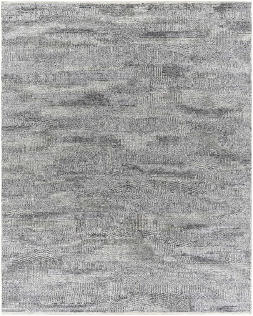 Close-up of the Chepe Area Rug, a hand woven, contemporary rug in charcoal, gray, and silver tones. Design-Rectangle-810