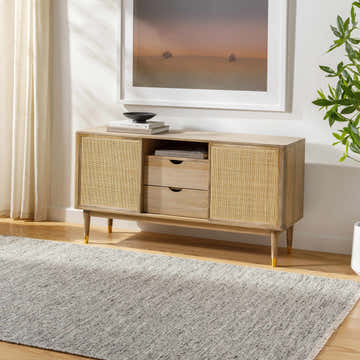 Living room scene with a light gray Kylee Gray Wool Area Rug, wood console table, and neutral decor. Roomscene-Rectangle