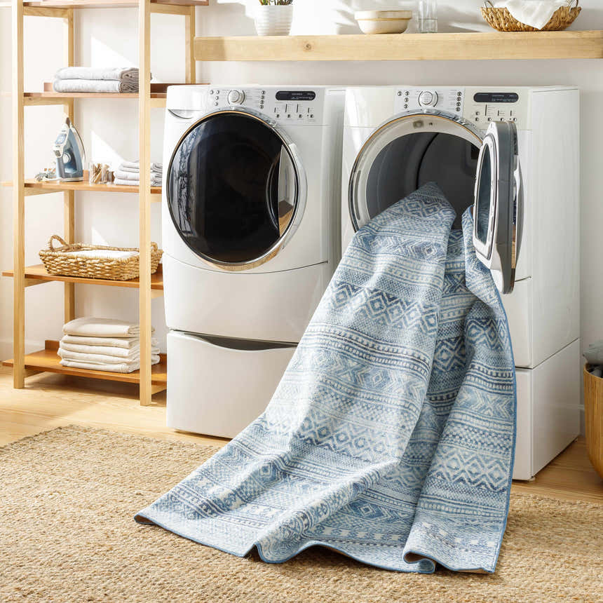 Laundry room scene with Gizeh Arctic Stone Washable Area Rug coming out of the washing machine. Farmhouse style. Washing-Machine