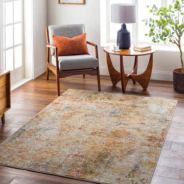 Living room scene with Bice Rich Textured Avant Garde Rug, gray chair, wood side table, and hardwood floors. Bone, clay, and gray tones. Roomscene-Rectangle
