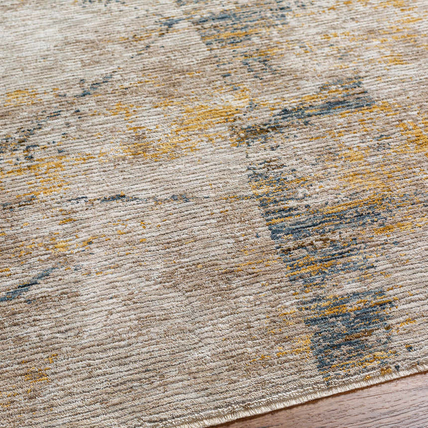 Close-up of the Cadao Rich Textured Traditional Rug, showcasing its light peach, mocha, blue and multi-brown tones. Texture