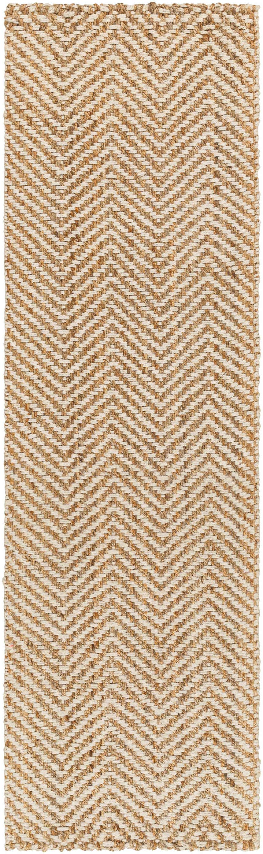 Close-up of the Aren Area Rug. Hand-woven jute rug with a geometric herringbone pattern in natural, tan, and light beige. Design-Runner-268