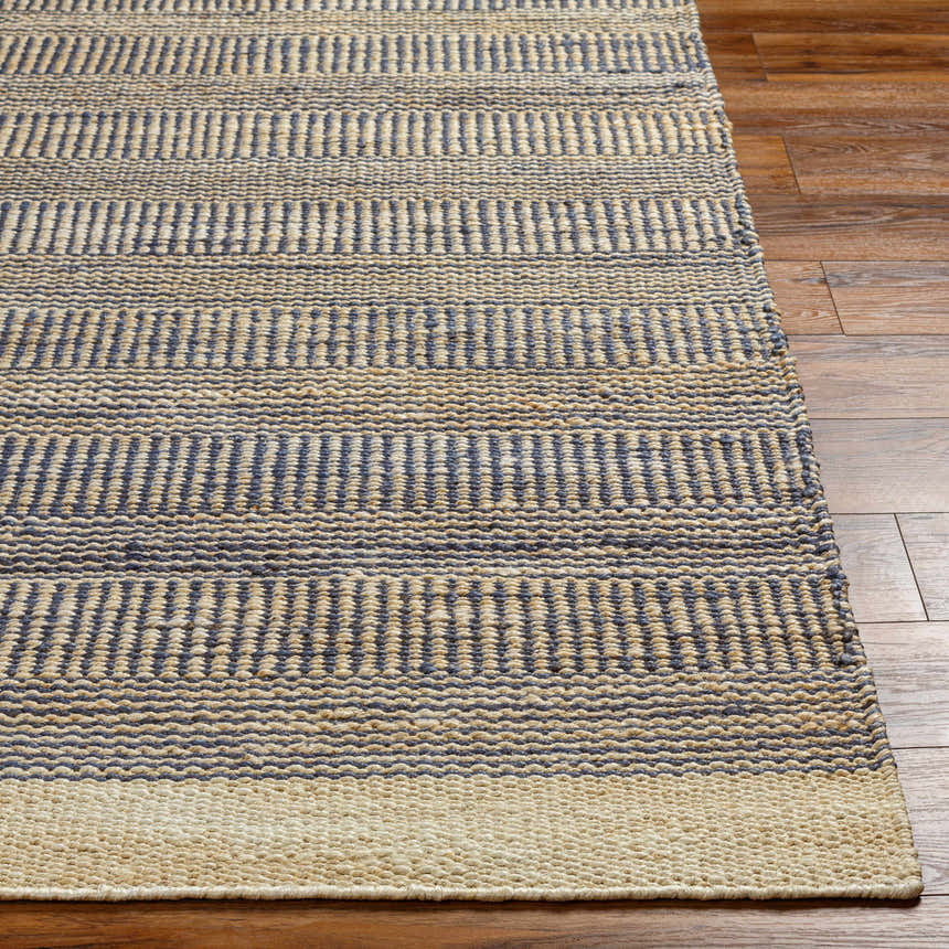 Close-up of the Blue Elle Area Rug showing denim and natural jute stripes and hand woven texture on wood floor. Front