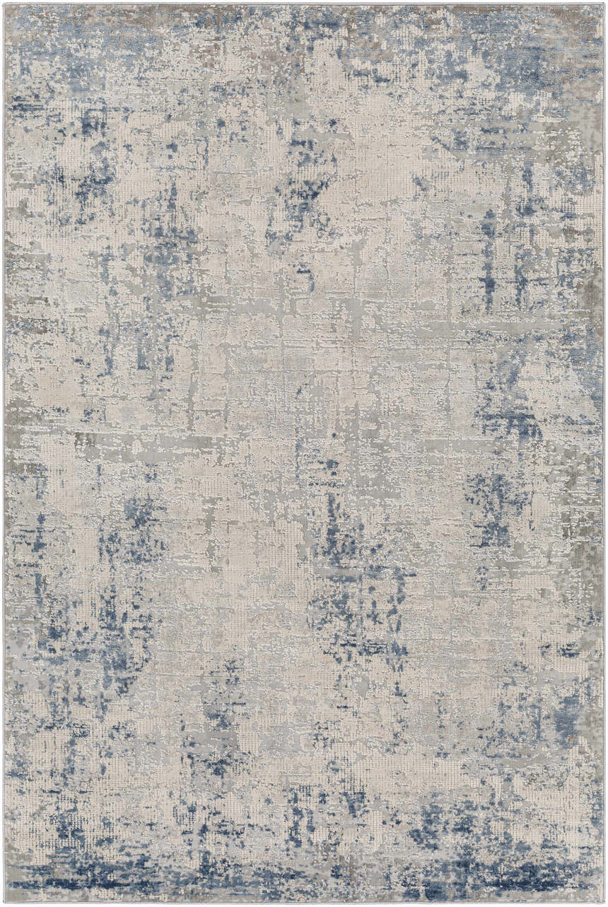 Close-up of the Saltair Textured Luxe Rug in blue, gray, and off-white. Contemporary style with a distressed pattern. Design-Rectangle-537