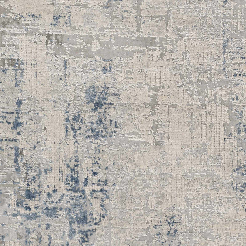 Close-up of the Saltair Textured Luxe Rug. Abstract pattern in blue, gray, off-white, and charcoal. Contemporary style. Swatch