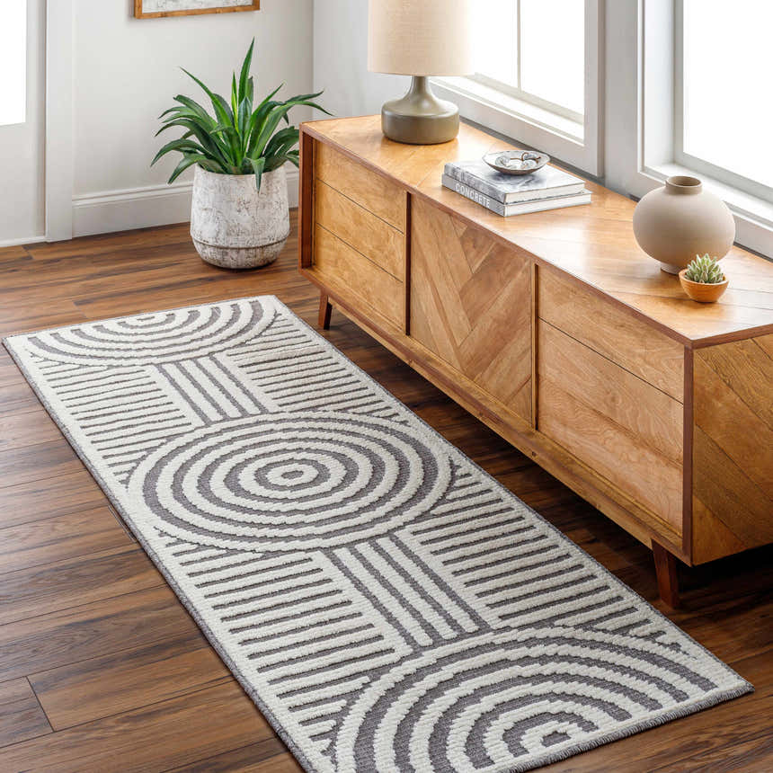 Hallway with wood floors and Deron Gray Rainbow Washable Rug. The rug has a geometric pattern with gray and white circles. Roomscene-Runner