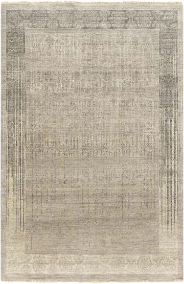 Close-up of the hand-knotted Petra 2x3 Carpet. Features dark brown, light gray, medium gray, and taupe colors. Wool texture. Design-Rectangle