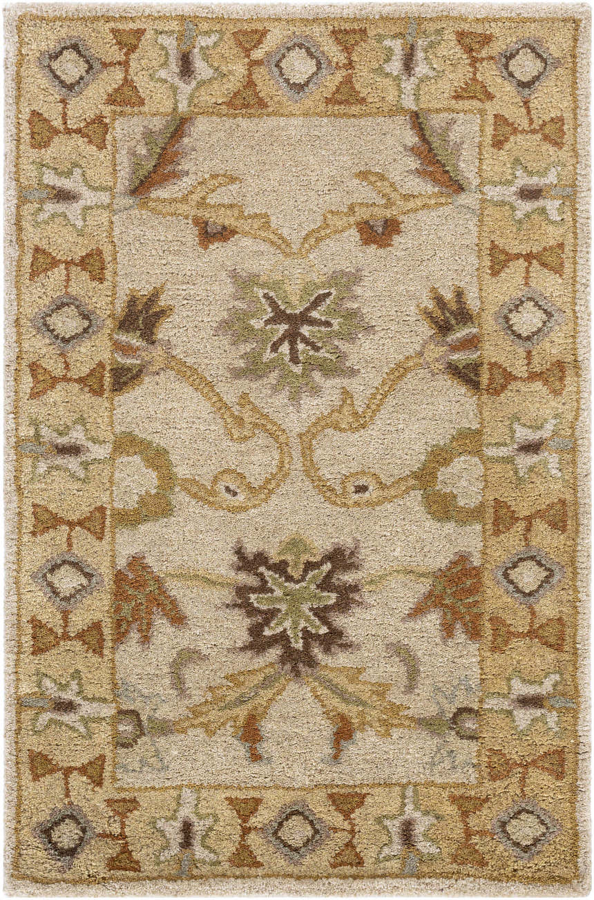 Close-up of the hand-tufted Smoot Area Rug. Beige wool rug with traditional brown, olive, and tan floral and geometric pattern. Design-Rectangle-23