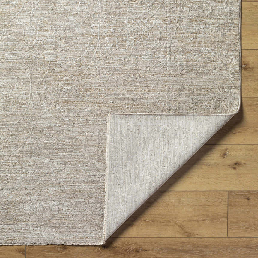 Close-up of the light gray and natural gray Kyran Area Rug showing the farmhouse style pattern and texture. Fold