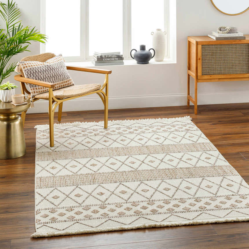 Living room scene with a beige and brown geometric Finch Area Rug, chair, and wood cabinet. Roomscene-Rectangle